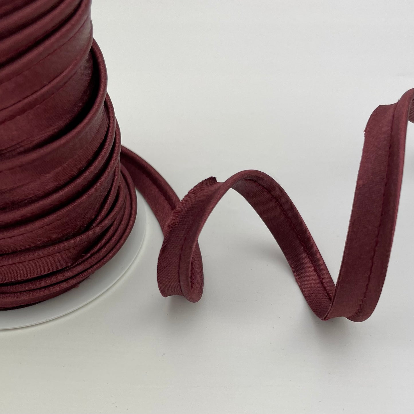 Paspelband Satin Uni 10mm
bordeaux